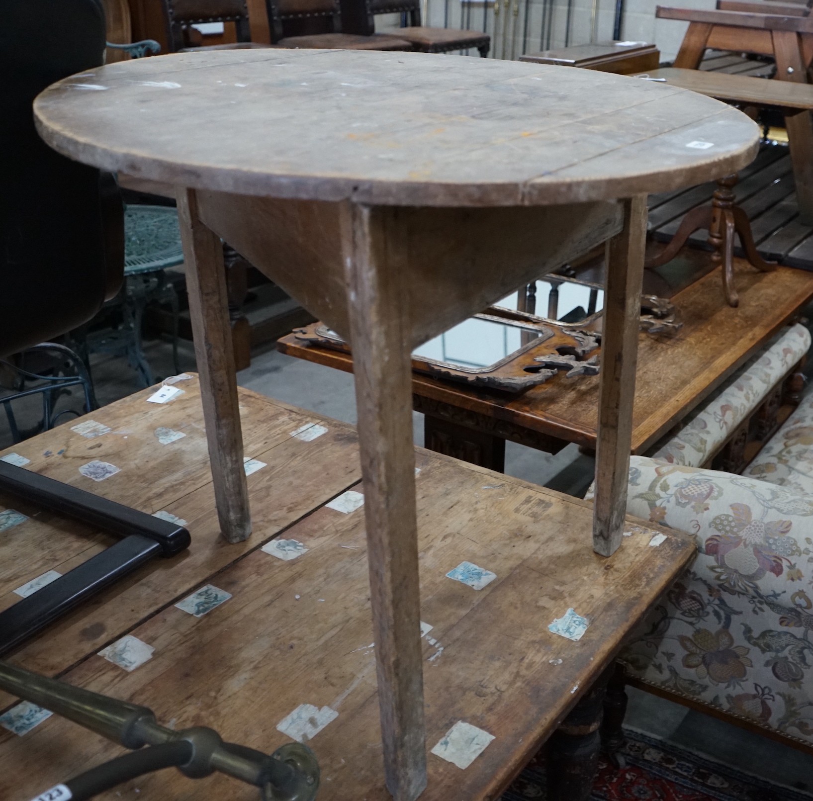 A 19th century circular pine cricket table, diameter 84cm, height 75cm